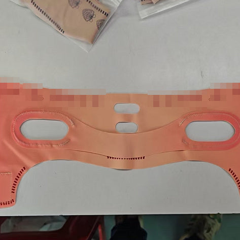 Face mask bandage for lifting and tightening, peach color, designed for facial enhancement, mask type product.