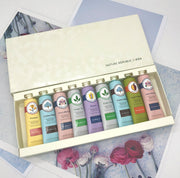 Nature Republic non greasy hand cream collection featuring various scented tubes in a stylish gift box.