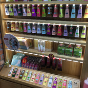non greasy hand cream display showcasing various natural hand cream products on a wooden shelf.