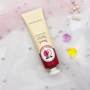 non greasy hand cream natural hand cream in a tube with decorative pearls and gems.